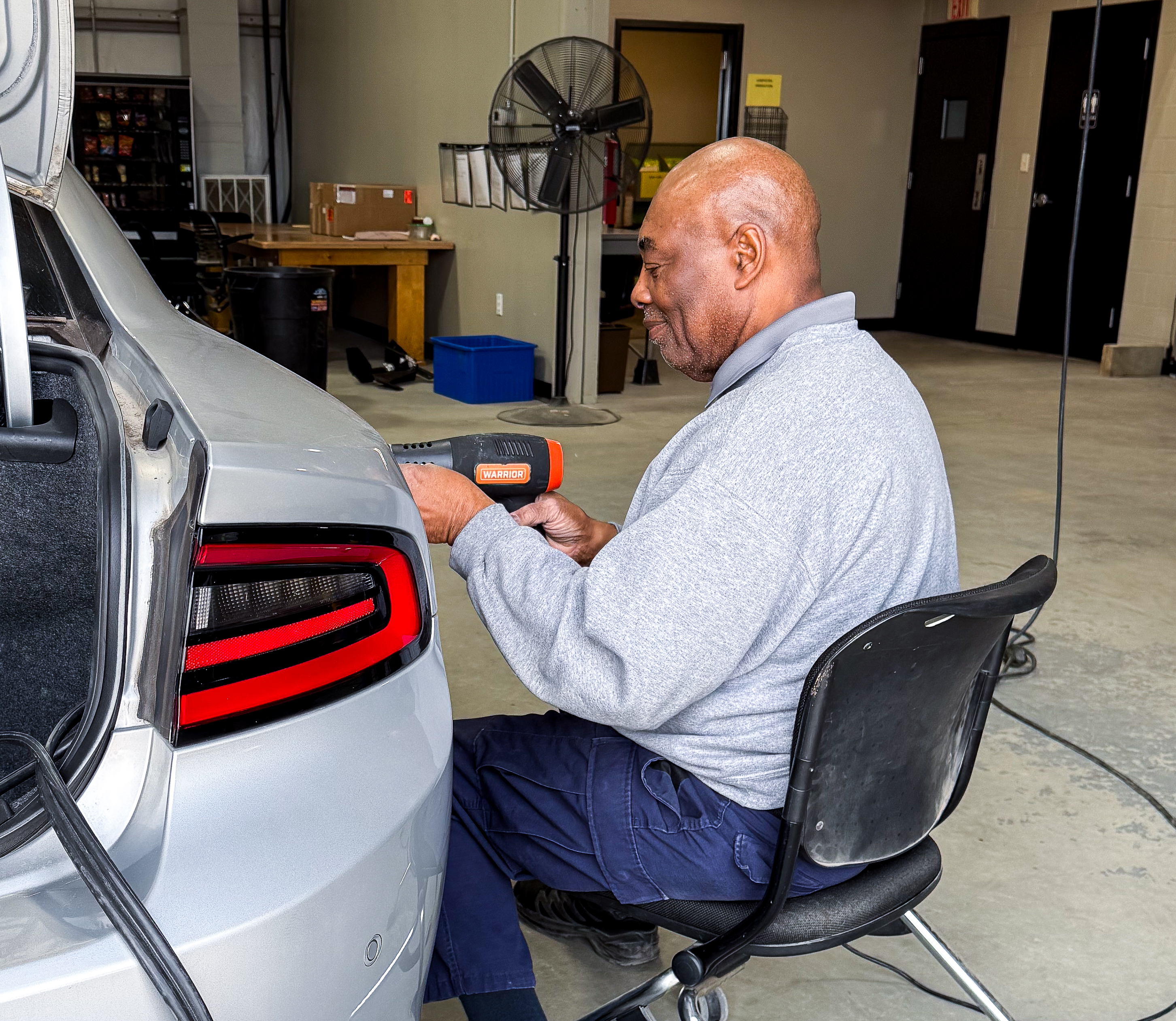 Wendell Walker working on a Highway Patrol vehicle