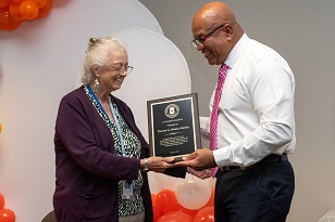Baskins received a certificate for 32 years of service