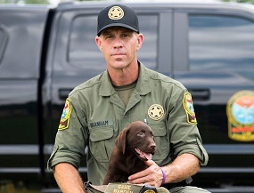Lieutenant Brady Branham with his dog