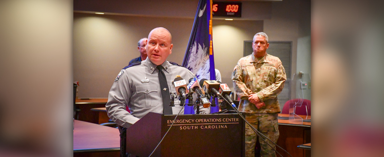 Major Logdon speaking at the Emergency Management Division's press conference